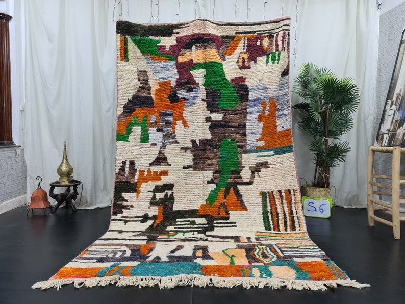 Authentic Handmade Moroccan Berber Wool Rug 8 x 5 Feet: Authentic Handmade Moroccan Berber Wool Rug 8 x 5 Feet Experience the vibrant beauty of this Authentic Artistic Colorful Handmade Moroccan Berber Wool Rug. Handwoven in the picturesque Atlas Mountains