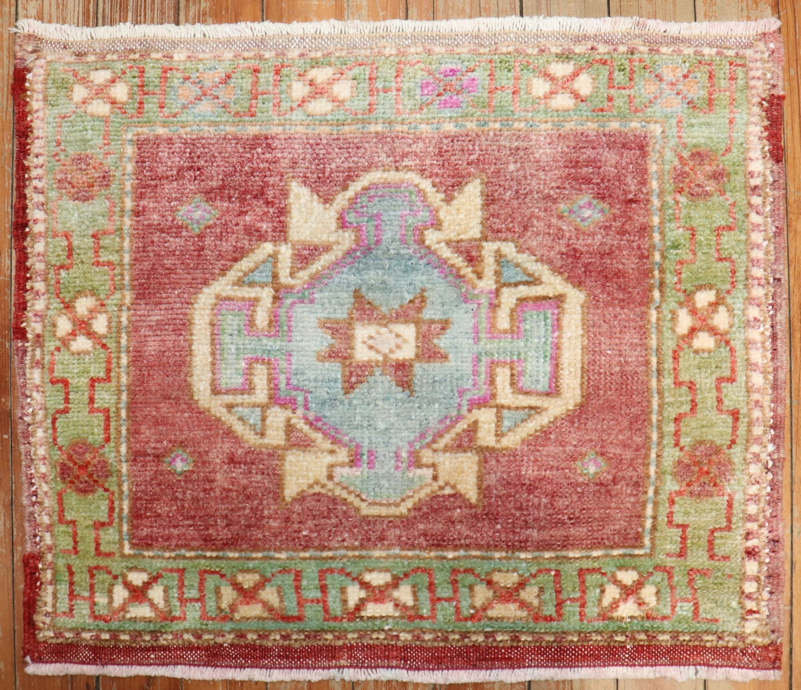 1' 5" x 1' 8" Turkish Anatolian square Yastik rug: 1' 5" x 1' 8" Turkish Anatolian square Yastik rug Mid-20th century Turkish Anatolian mini rug in a square Yastik form, featuring a central geometric pattern with detailed border motifs. Pre-owned. Spe