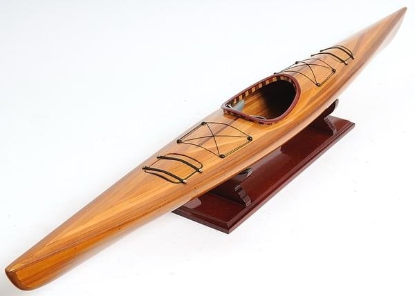 Handcrafted Wooden Kayak Model Mahogany Rosewood Cedar 42": Handcrafted Wooden Kayak Model Mahogany Rosewood Cedar 42" This exquisite Masterpiece Wooden Kayak Replica is a stunning representation of craftsmanship, showcasing a hand-built plank-on-frame and str