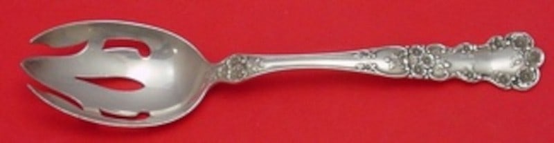 Sterling Silver Pierced Serving Spoon Buttercup Pattern 8 3/8 Inch: Sterling Silver Pierced Serving Spoon Buttercup Pattern 8 3/8 Inch This Gorham Buttercup pierced serving spoon features an intricate floral motif along the handle and neck, highlighted by a slender ce
