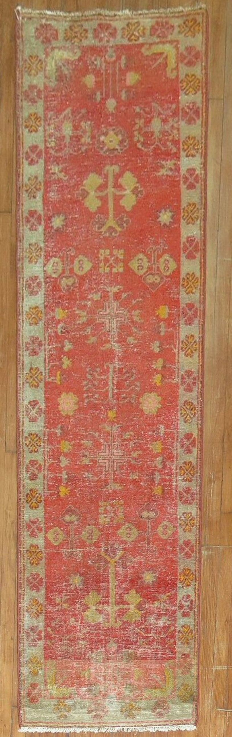 2' 5" x 9' 19th Century Khotan Shabby Chic Runner: 2' 5" x 9' 19th Century Khotan Shabby Chic Runner Antique distressed Khotan runner with a shabby chic look. This 19th century pre-owned rug features a traditional patterned design and elongated runner
