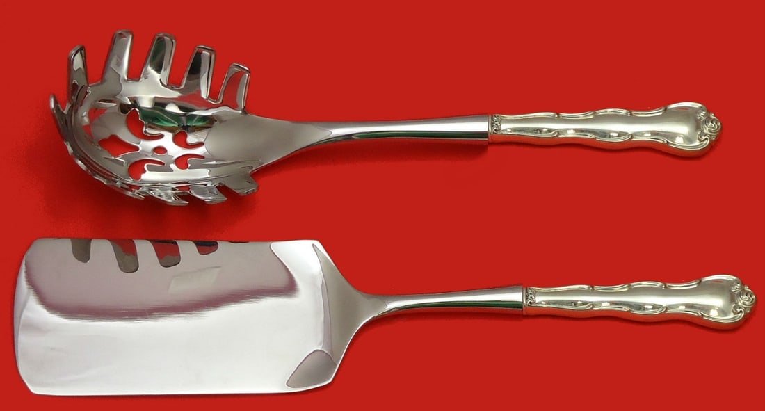Rondo by Gorham Sterling Silver 2pc Italian Pasta Server Set: Rondo by Gorham Sterling Silver 2pc Italian Pasta Server Set Enhance your culinary experience with this exquisite Rondo by Gorham Sterling Silver Italian Pasta Server Set. This two-piece serving set i