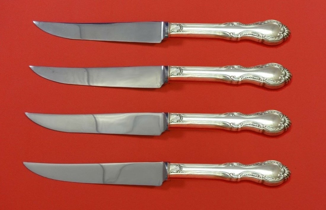 International Sterling Silver Southern Colonial Steak Knife Set 4pc: International Sterling Silver Southern Colonial Steak Knife Set 4pc Enhance your dining experience with this exquisite 4-piece Steak Knife Set, crafted in the elegant Southern Colonial pattern by Inte