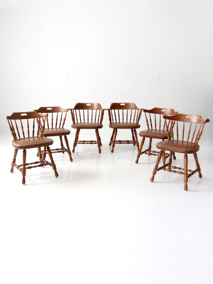 6 Piece Dinaire Windsor Dining Chair Set with 2 Armchairs: 6 Piece Dinaire Windsor Dining Chair Set with 2 Armchairs Set of 6 vintage Dinaire wooden dining chairs, including two Windsor armchairs and four matching side chairs. The set features sculpted faux l