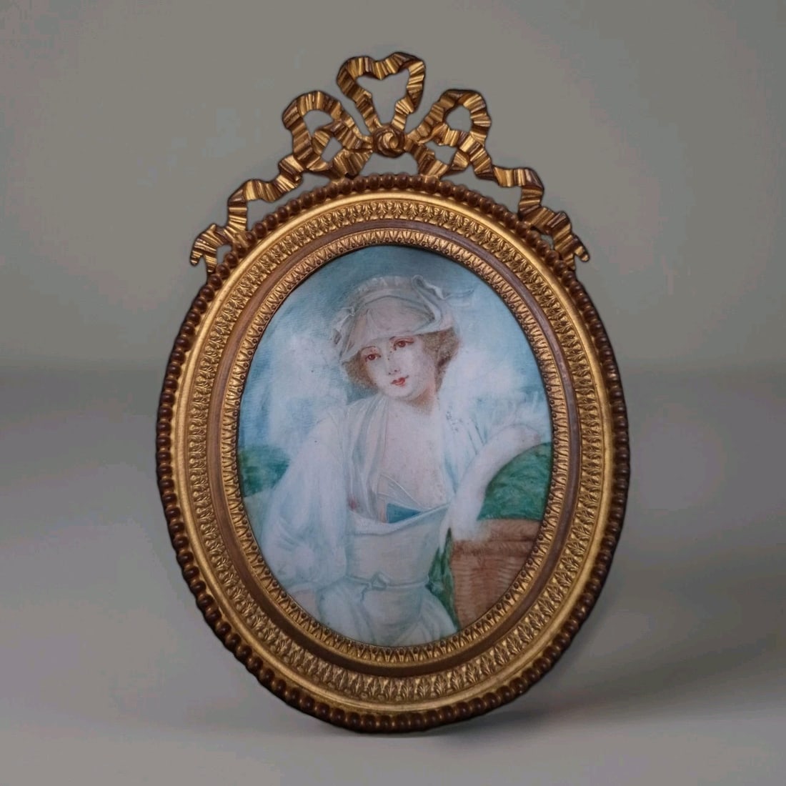 French Framed Miniature Portrait Painting with Bronze Easel 5.5: French Framed Miniature Portrait Painting with Bronze Easel 5.5 Antique original miniature portrait painting depicting a young woman in a classic 3/4 bust pose. This hand-painted piece is presented in