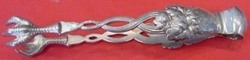 Tiffany & Co. Strawberry Vine Sterling Silver Sugar Tong 4.25": Tiffany & Co. Strawberry Vine Sterling Silver Sugar Tong 4.25" This exquisite sugar tong from Tiffany & Co. features the elegant Strawberry Vine pattern, showcasing the brand's renowned craftsmanship 