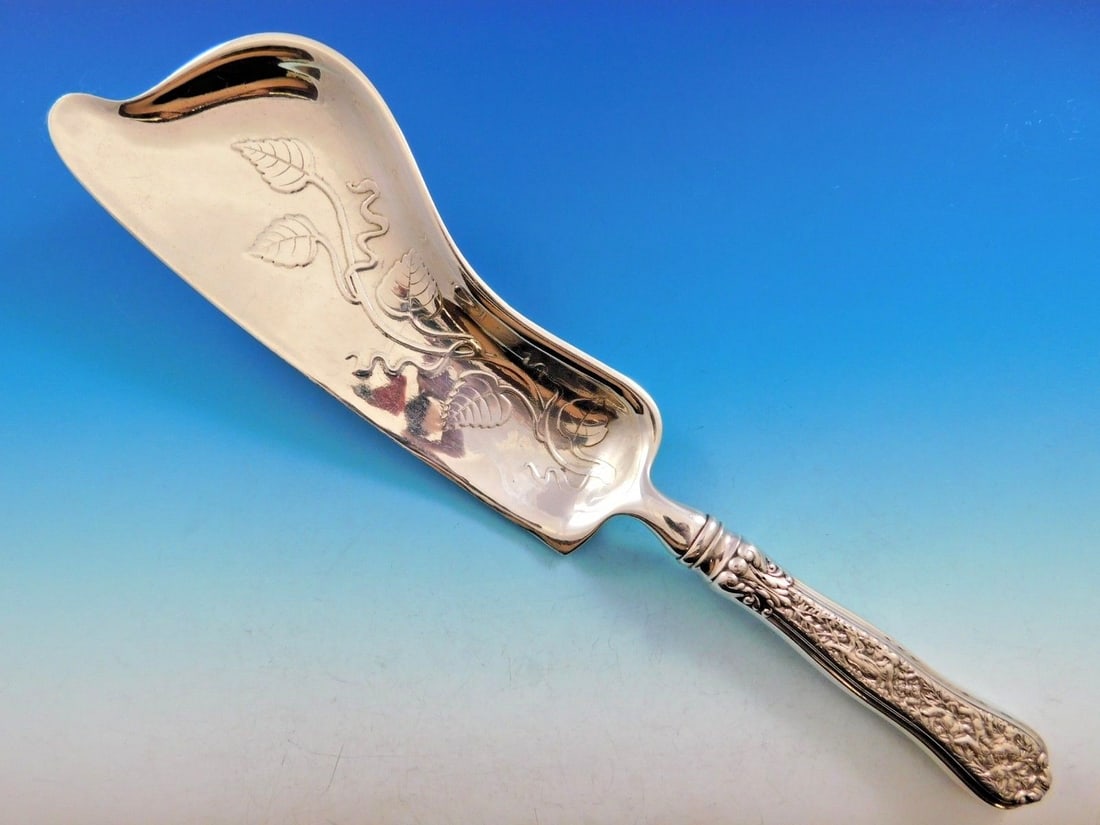 Tiffany & Co Olympian Sterling Silver Crumber 13 7/8 inch Monogrammed: Tiffany & Co Olympian Sterling Silver Crumber 13 7/8 inch Monogrammed Discover the exquisite Olympian Crumber by Tiffany & Co., crafted from sterling silver. This serving piece, introduced in 1878, sh