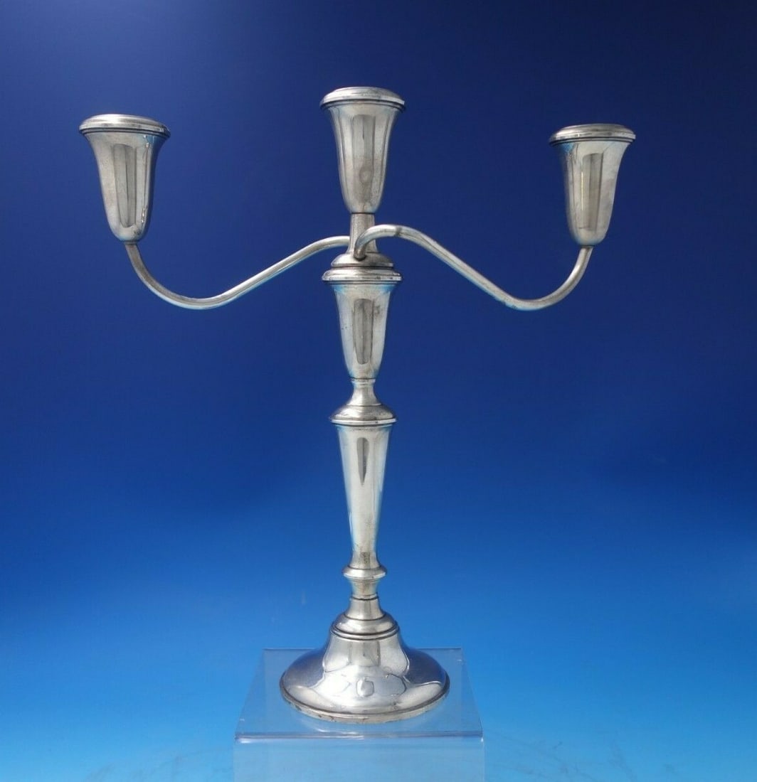 Empire Sterling Silver 3-Light Candelabra Vintage 1940: Empire Sterling Silver 3-Light Candelabra Vintage 1940 This exquisite Empire Sterling Silver Candelabra features a stunning three-light design, crafted around 1940. Measuring 12 1/2" in height and 11"