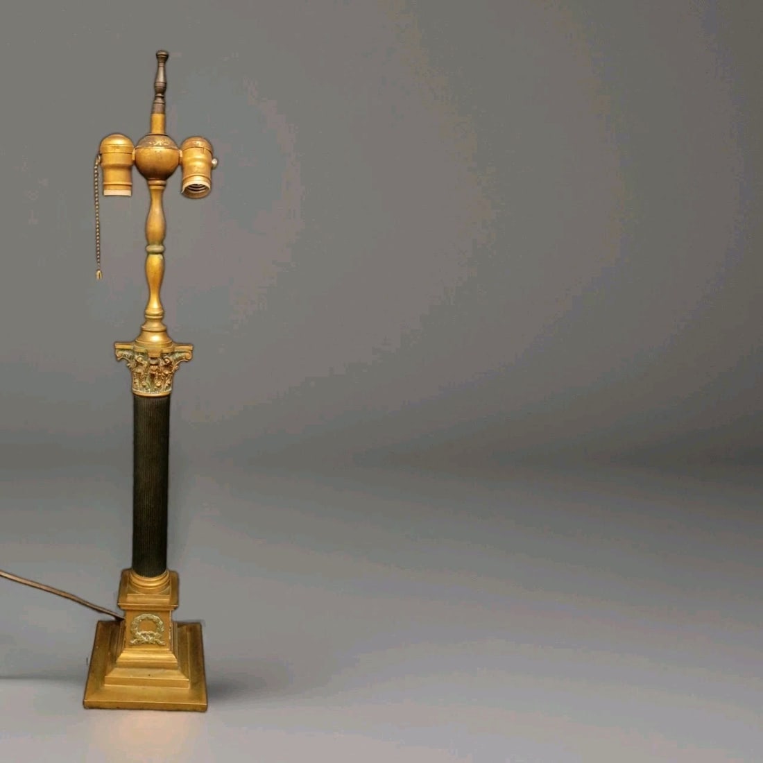 31 in French Empire bronze column lamp with Corinthian pillar: 31 in French Empire bronze column lamp with Corinthian pillar Antique French Empire columnar lamp with a Neo-Classical design, finely cast in bronze and porcelain. The piece features an angels and Cor