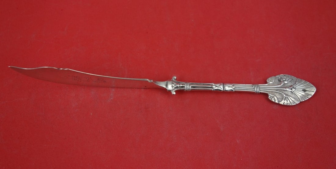 Whiting Lotus Sterling Silver Master Butter Knife 7 1/2 Inch Twist Handle: Whiting Lotus Sterling Silver Master Butter Knife 7 1/2 Inch Twist Handle This is a Whiting sterling silver master butter knife in the Lotus pattern, featuring a flat handle with a distinctive twist d