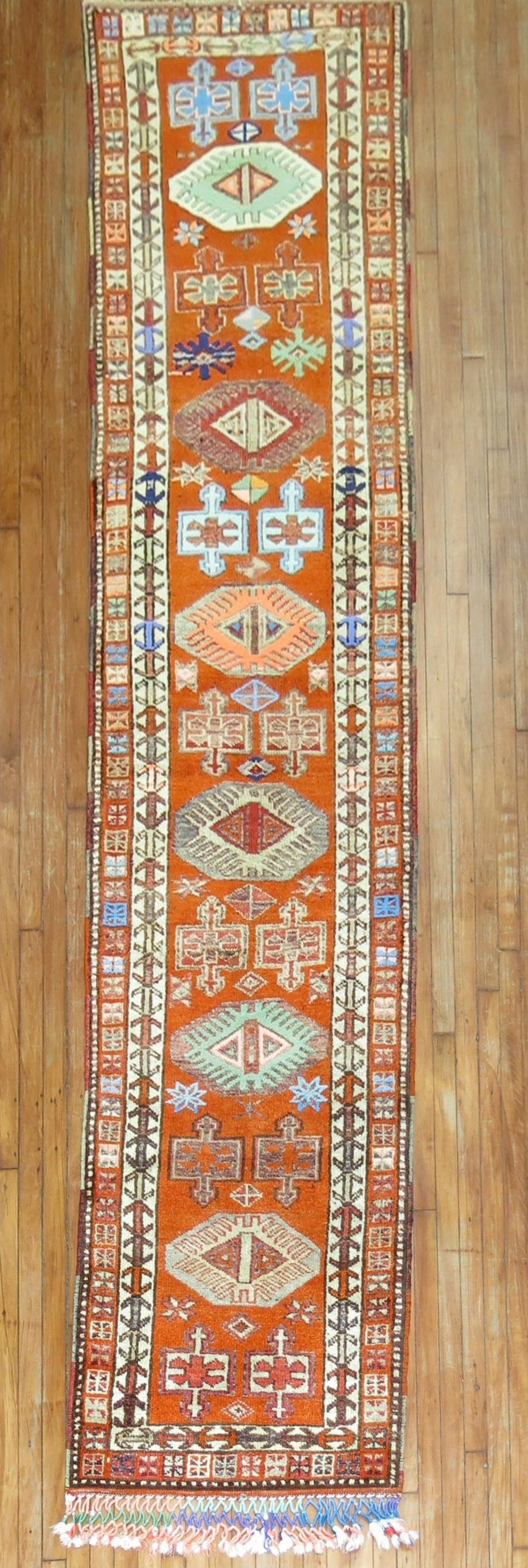 2' 9" x 12' 6" Turkish Anatolian rug runner in orange: 2' 9" x 12' 6" Turkish Anatolian rug runner in orange Vintage Turkish Anatolian runner from the mid-20th century with an orange palette. This pre-owned rug is categorized as a runner and identified as