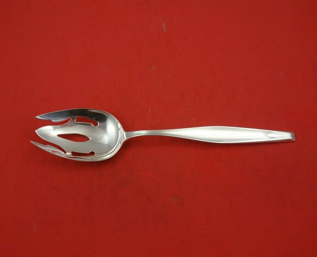 Gorham Classique Sterling Silver Slotted Serving Spoon 8 3/8": Gorham Classique Sterling Silver Slotted Serving Spoon 8 3/8" Enhance your dining experience with this exquisite Classique by Gorham Sterling Silver Serving Spoon. This slotted spoon features a beauti