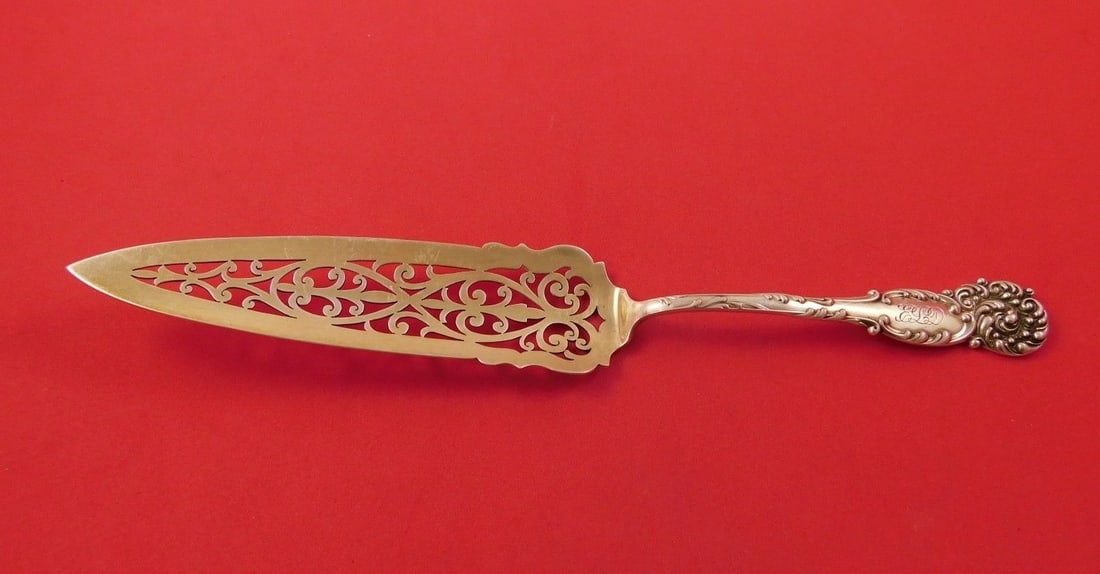 Reed & Barton La Reine Sterling Silver Jelly Cake Server Gold Wash 9 3/4": Reed & Barton La Reine Sterling Silver Jelly Cake Server Gold Wash 9 3/4" This exquisite La Reine jelly cake server from Reed & Barton is crafted from sterling silver and features a luxurious gold was