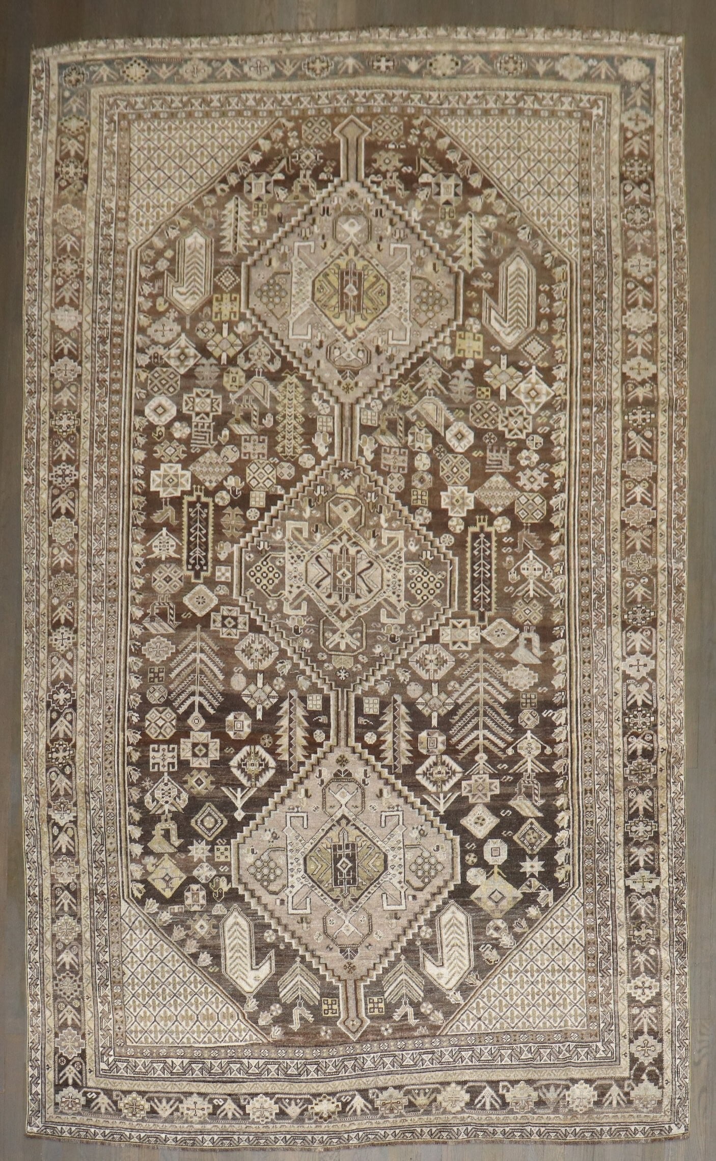 6' 4" x 10' 3" Antique Shiraz Tribal Persian Rug: 6' 4" x 10' 3" Antique Shiraz Tribal Persian Rug Antique Persian tribal Shiraz rug from the early 20th century. This intermediate-size pre-owned rug reflects the traditional Shiraz type noted in the o