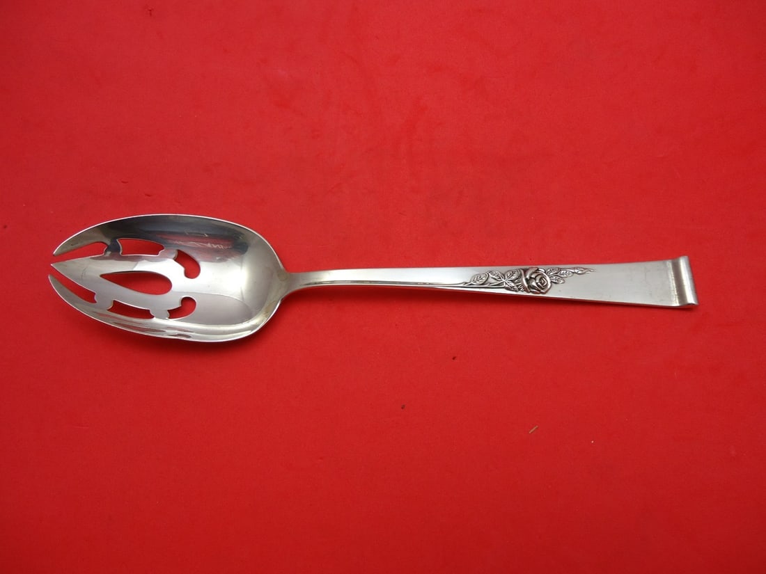 Reed and Barton Classic Rose Sterling Silver Slotted Spoon 8 5/8 Inches: Reed and Barton Classic Rose Sterling Silver Slotted Spoon 8 5/8 Inches Enhance your dining experience with this exquisite Classic Rose Serving Spoon by Reed and Barton. Crafted from high-quality ster