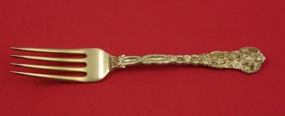 Shreve & Co Chased Vine Gold Vermeil Dessert Fork 6.5": Shreve & Co Chased Vine Gold Vermeil Dessert Fork 6.5" This exquisite dessert fork, crafted by Shreve & Co., features the elegant Chased Vine Vermeil pattern. Made of sterling silver with a beautiful 