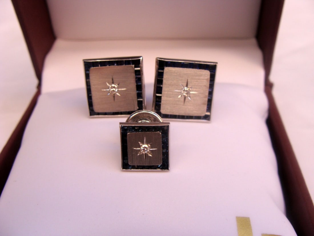Lucien Piccard 3 Piece 14K White Gold Sapphire Diamond Cufflink Set: Lucien Piccard 3 Piece 14K White Gold Sapphire Diamond Cufflink Set This exquisite 3-piece cufflink and tie holder set showcases the elegance of 14K white gold, adorned with sparkling diamonds and sap