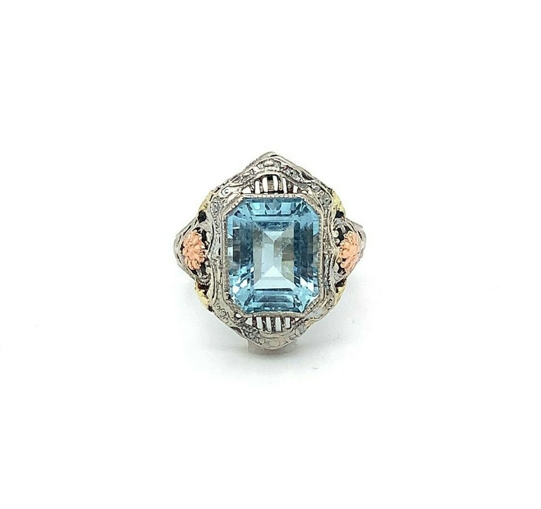 Art Deco 10k Tri-Color Gold Aquamarine Filigree Ring 3.28ct GIA Certified: Art Deco 10k Tri-Color Gold Aquamarine Filigree Ring 3.28ct GIA Certified This exquisite Art Deco ring is crafted in 10k tri-color gold, showcasing a stunning 3.28ct genuine natural aquamarine. The ri