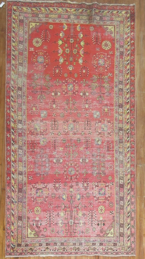 Late 19th Century Khotan Gallery Rug 6' 4" x 12' 8" Red: Late 19th Century Khotan Gallery Rug 6' 4" x 12' 8" Red Late 19th century worn Khotan gallery rug with a red field. This pre-owned piece is identified as a gallery rug. Specifications Item Type: Rug T