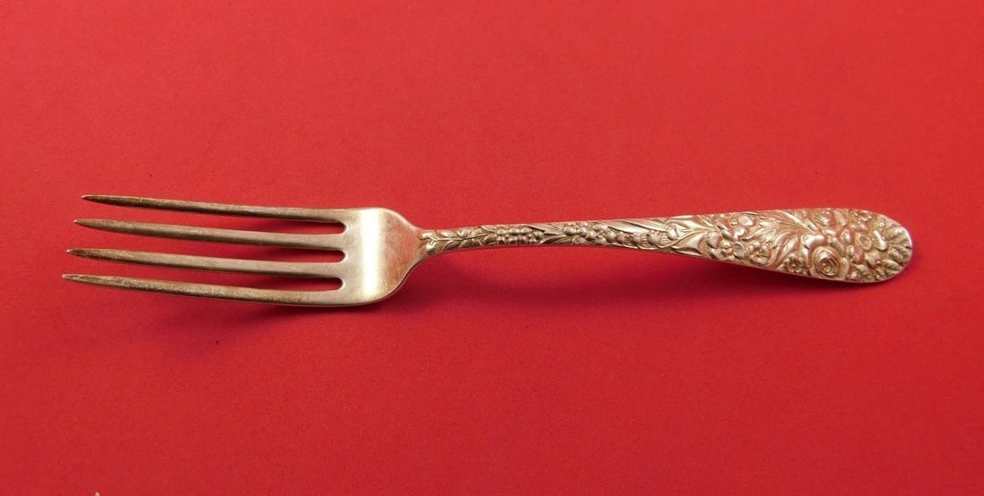 7 inch sterling silver dinner fork in Repousse pattern: 7 inch sterling silver dinner fork in Repousse pattern A sterling silver regular fork in the Repousse pattern by unknown maker. The fork measures 7 inches and is not monogrammed. It is in excellent pr