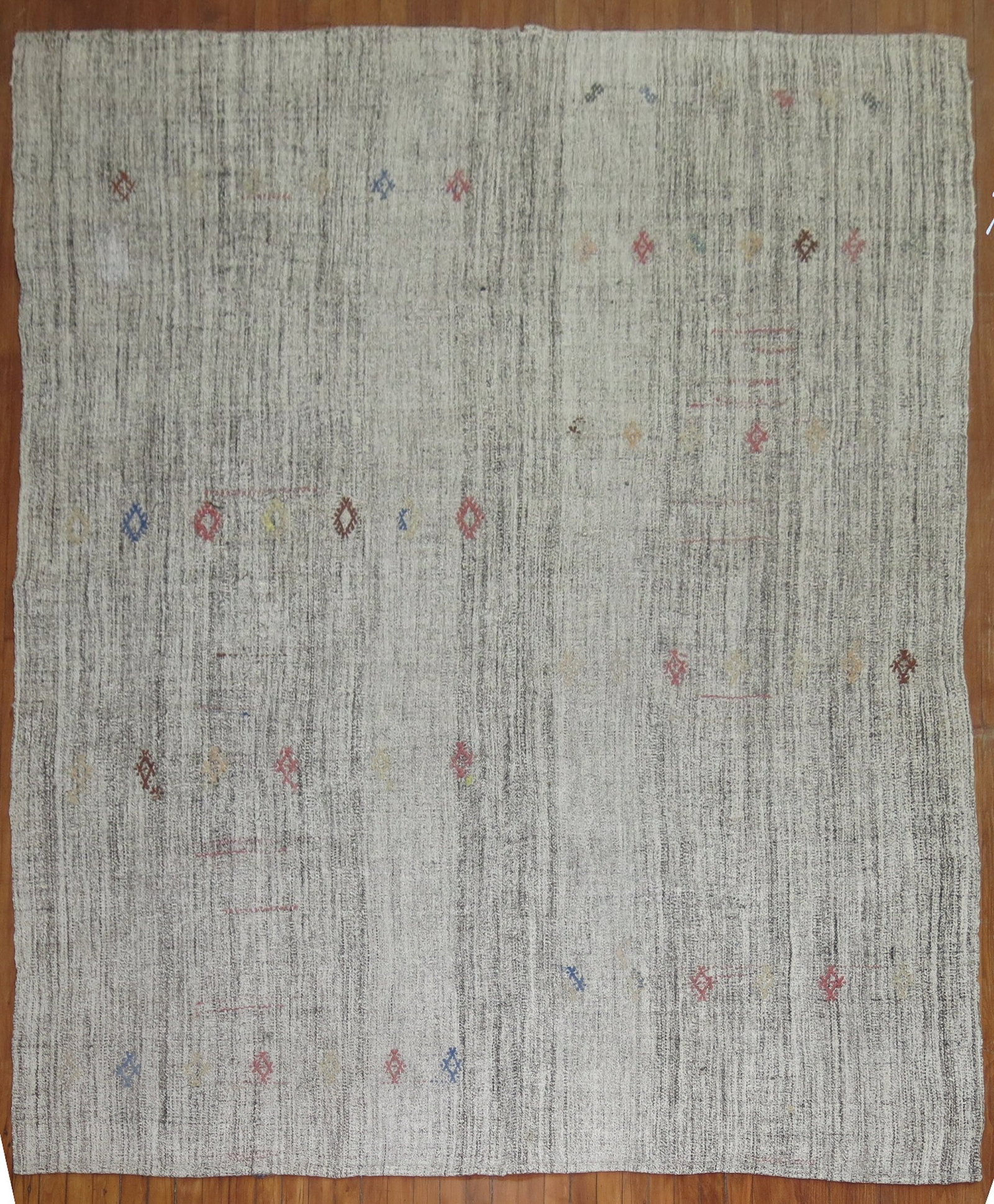 7' 1" x 9' 4" Vintage Turkish Kilim Rug in Gray: 7' 1" x 9' 4" Vintage Turkish Kilim Rug in Gray Vintage Turkish kilim in a primitive gray design with a room-size format. This pre-owned woven rug features a muted palette and geometric patterning con
