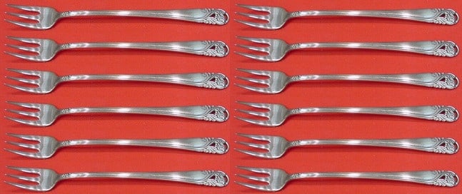 International Sterling Silver Spring Glory Cocktail Fork Set 12 pcs 5.5": International Sterling Silver Spring Glory Cocktail Fork Set 12 pcs 5.5" Enhance your dining experience with this exquisite 12-piece cocktail fork set in the elegant "Spring Glory" pattern by Internat