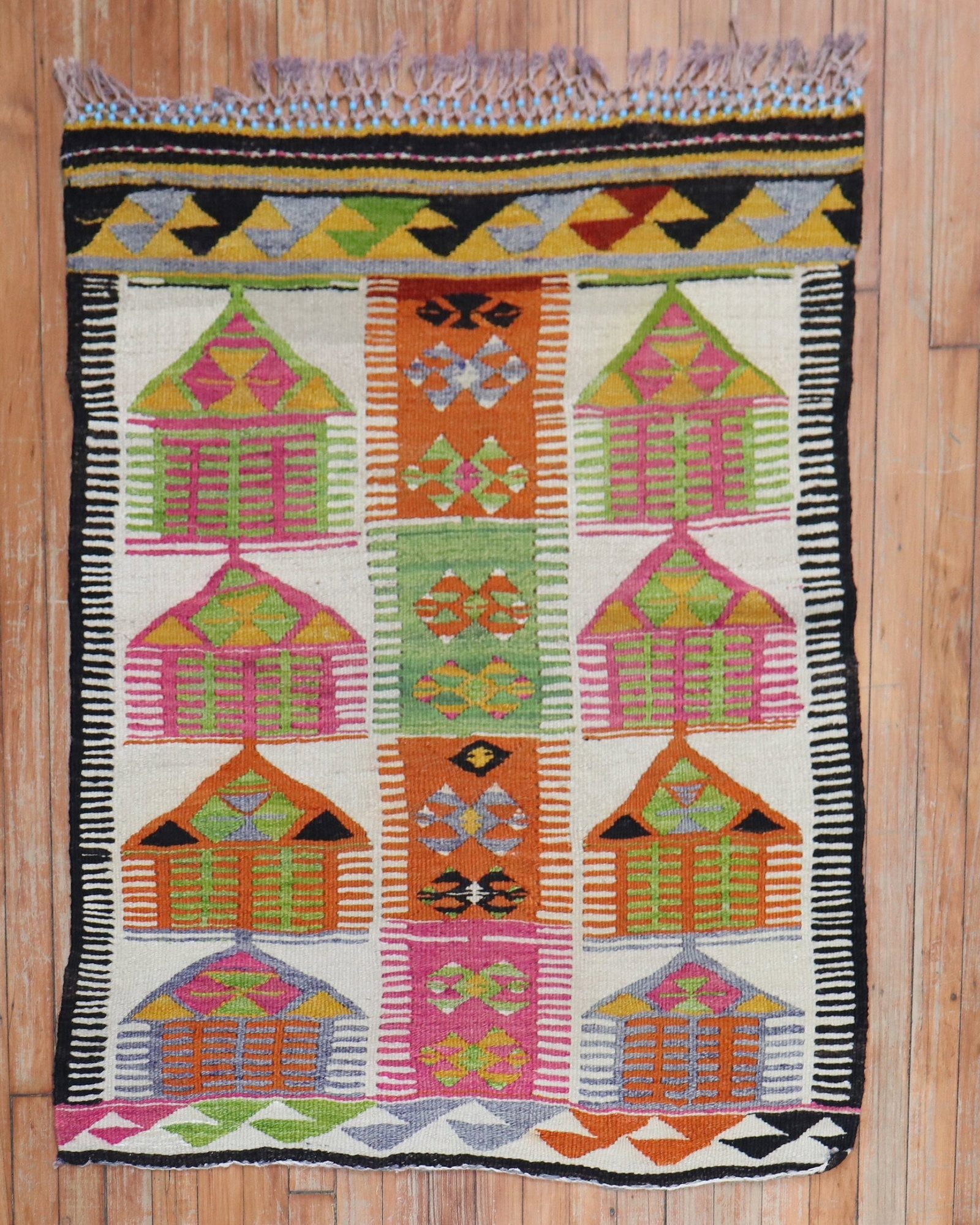 3' x 4' Small Turkish Kilim Rug with Colorful Tribal Motifs: 3' x 4' Small Turkish Kilim Rug with Colorful Tribal Motifs Mid-20th century Turkish kilim with a colorful tribal design. This pre-owned small kilim features a geometric pattern and is suited for use 