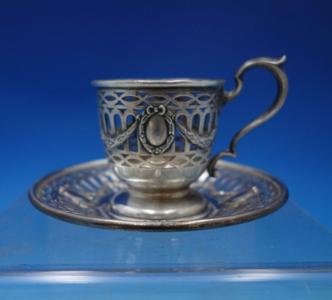 Durgin Du Barry Sterling Silver Demitasse Cup and Saucer Set: Durgin Du Barry Sterling Silver Demitasse Cup and Saucer Set Presenting a remarkable Du Barry demitasse cup and saucer set by Durgin, crafted from high-quality sterling silver. This exquisite set date