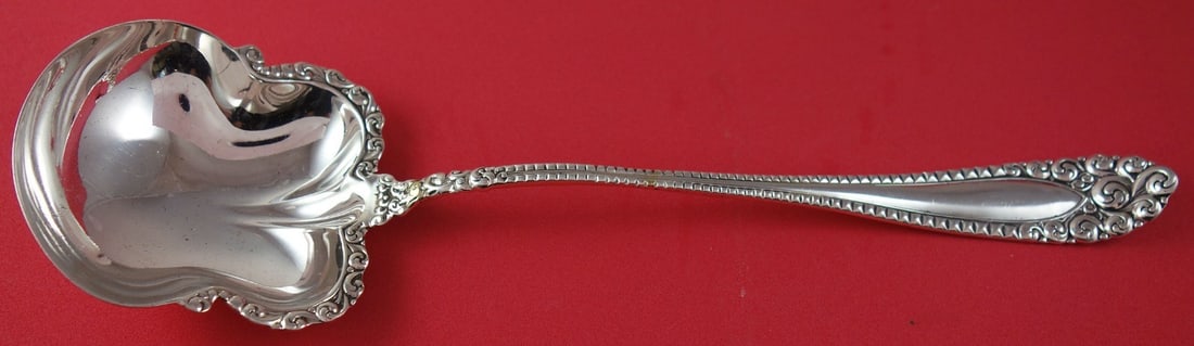 International Silver Kenilworth Sterling Silver Salad Serving Spoon 9 3/4": International Silver Kenilworth Sterling Silver Salad Serving Spoon 9 3/4" This exquisite salad serving spoon, part of the Kenilworth pattern by International Silver, showcases a timeless design craft
