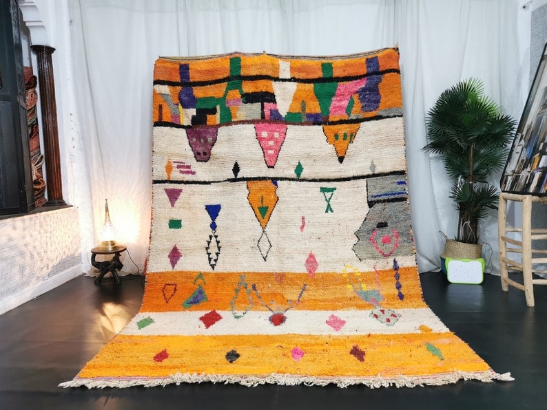 Authentic Handmade Moroccan Berber Wool Rug 8 x 5 Feet: Authentic Handmade Moroccan Berber Wool Rug 8 x 5 Feet Experience the beauty of this Stunning Authentic Colorful Handmade Moroccan Berber Wool Rug. Handwoven by local Berber women weavers in the breat