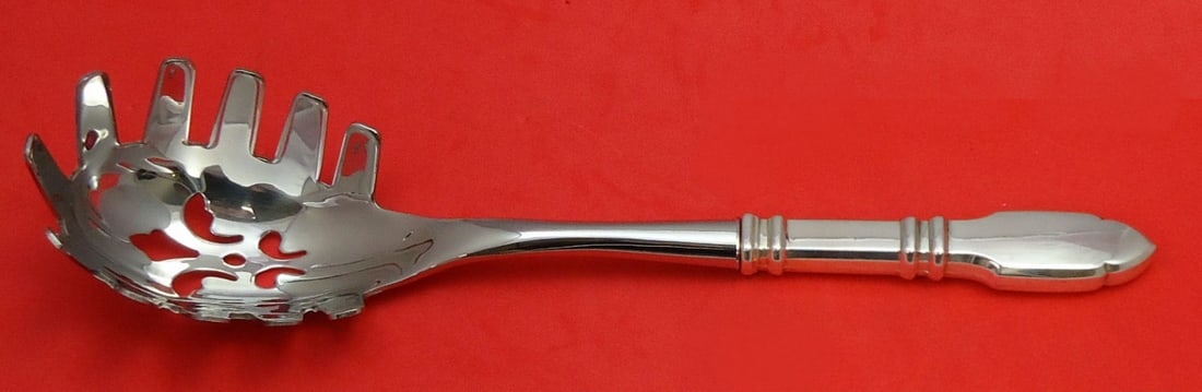Custom Made Graff W & D Robert Bruce Sterling Silver Pasta Server 10 3/4": Custom Made Graff W & D Robert Bruce Sterling Silver Pasta Server 10 3/4" This custom-made pasta server from the renowned maker Graff W & D is crafted from high-quality sterling silver, featuring a ho