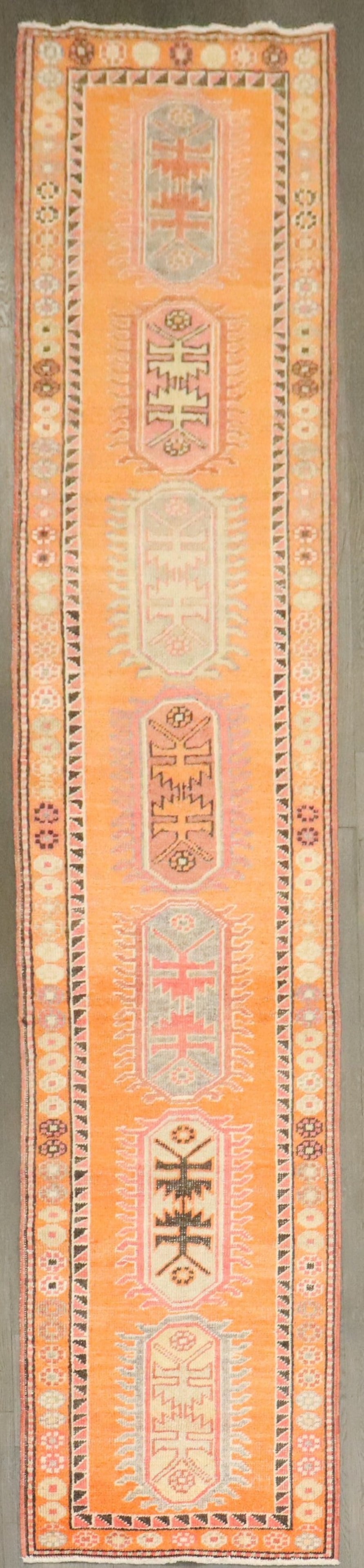 2' 7" x 12' 5" Mid 20th Century Anatolian Geometric Runner: 2' 7" x 12' 5" Mid 20th Century Anatolian Geometric Runner Mid-20th century Turkish Anatolian runner featuring an orange field with a geometric design. This pre-owned rug is categorized as a runner. S