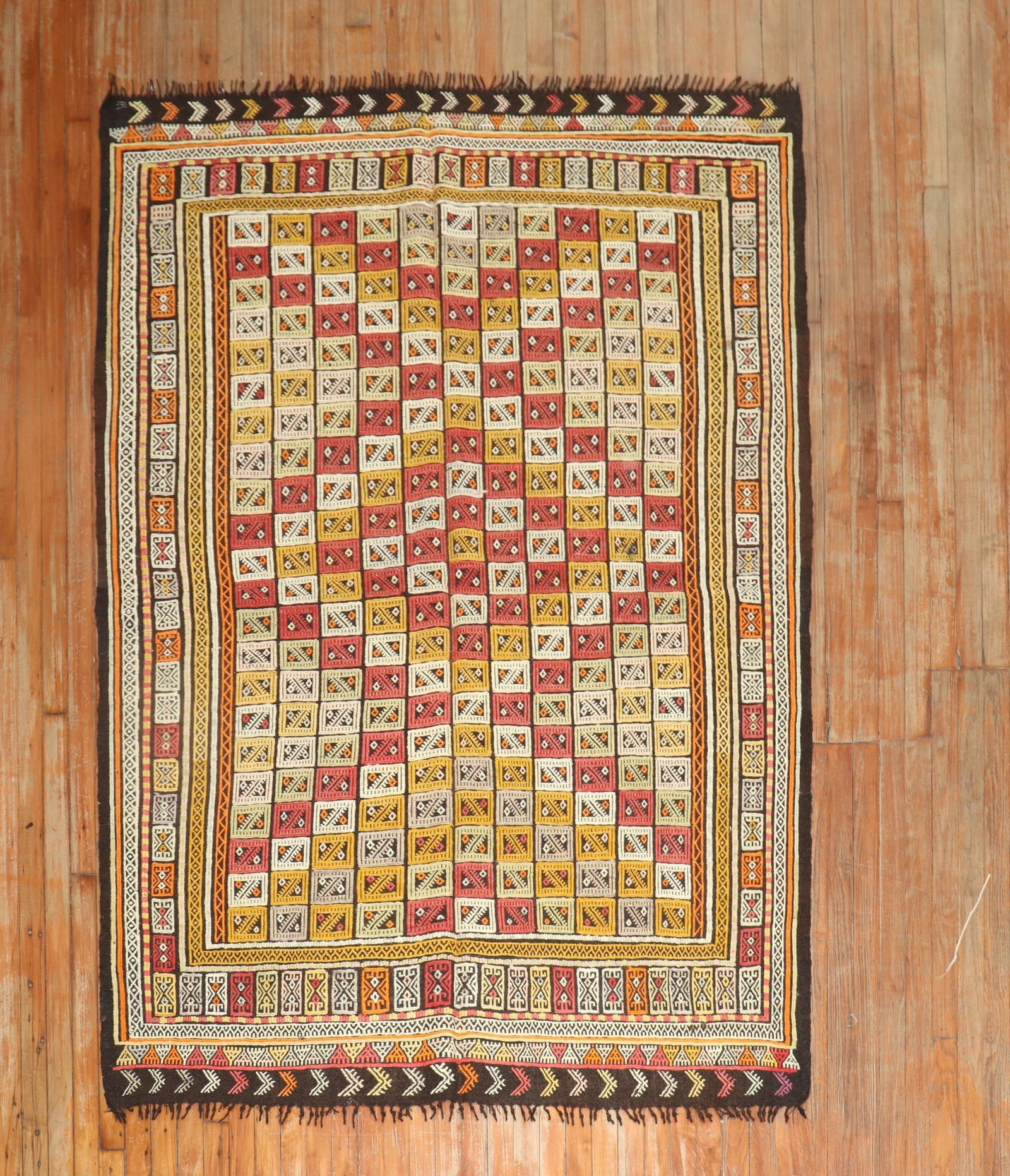 5' 2" x 7' 2" Turkish Jajim flatweave Kilim rug: 5' 2" x 7' 2" Turkish Jajim flatweave Kilim rug Mid-20th-century Turkish jajim flatweave kilim rug with a patterned grid design and bordered detailing. This pre-owned accent rug offers the distinctive