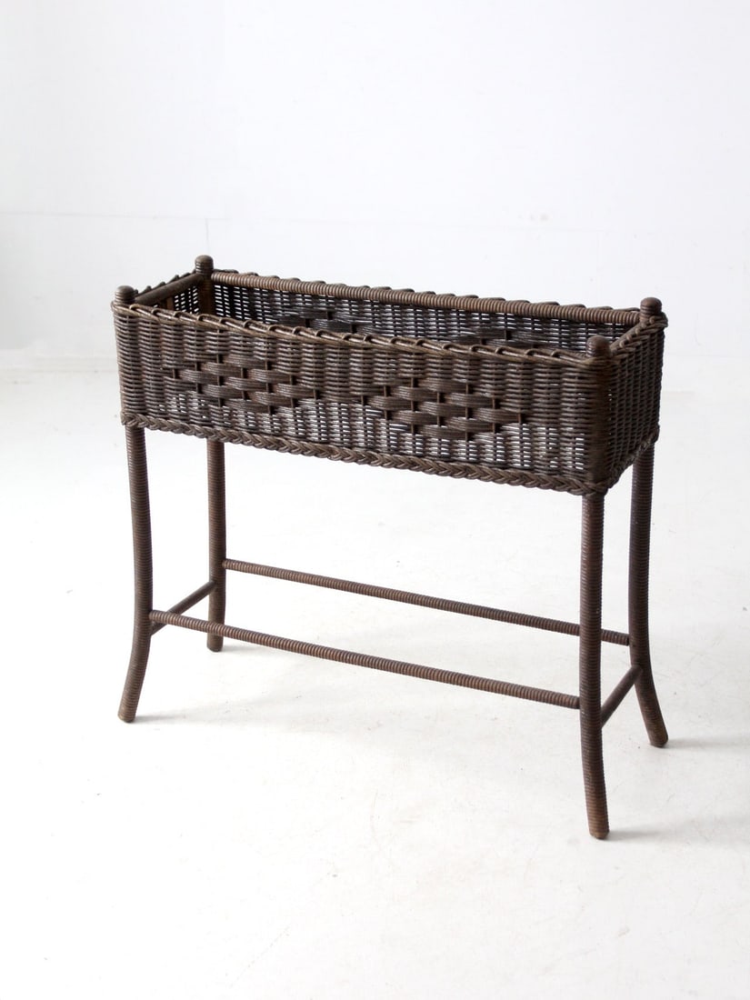 Antique Wicker Planter Stand with Galvanized Bucket 32.5": Antique Wicker Planter Stand with Galvanized Bucket 32.5" Enhance your living space with this antique woven wicker planter stand. Featuring intricately woven brown wicker, this piece adds a touch of n