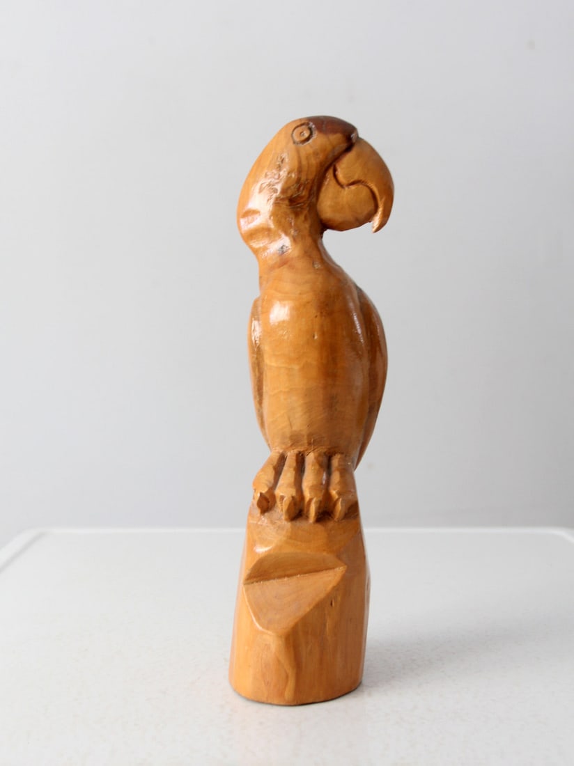 Vintage Hand Carved Wooden Parrot Figurine 14 inch: Vintage Hand Carved Wooden Parrot Figurine 14 inch This vintage hand-carved wooden parrot figurine showcases intricate craftsmanship and natural beauty. With its vibrant colors and detailed design, it
