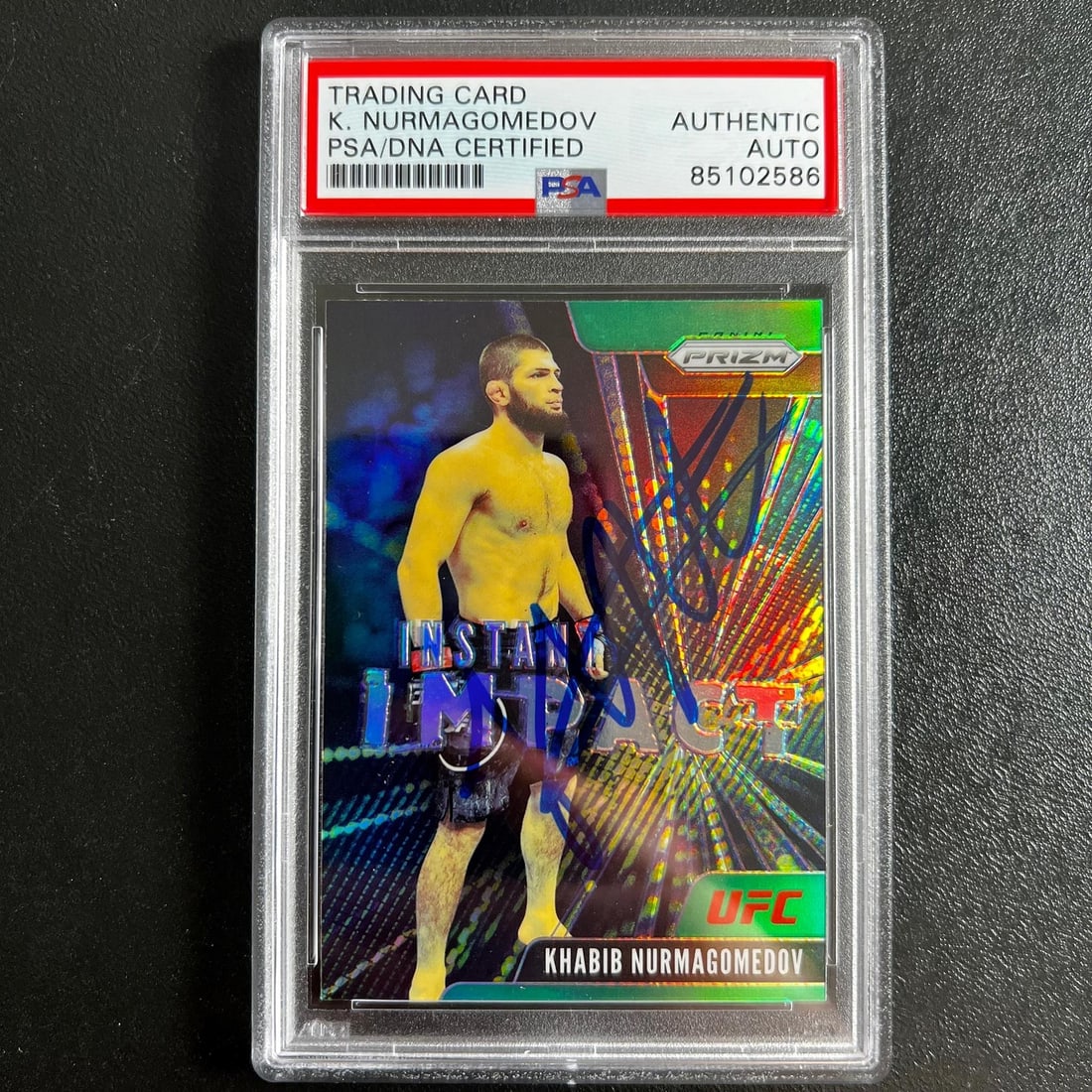 2021 Panini Prizm #2 Khabib Nurmagomedov Autographed PSA Slabbed Card: 2021 Panini Prizm #2 Khabib Nurmagomedov Autographed PSA Slabbed Card This is a 2021 Panini Prizm #2 signed sports trading card featuring Khabib Nurmagomedov, a prominent figure in the Ultimate Fighti
