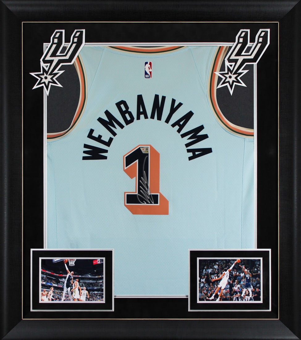 Framed 2024 Nike City Edition Jersey signed by Victor Wembanyama FAN: Framed 2024 Nike City Edition Jersey signed by Victor Wembanyama FAN Framed 2024 Nike City Edition jersey signed by Victor Wembanyama of the San Antonio Spurs. This original autographed piece includes
