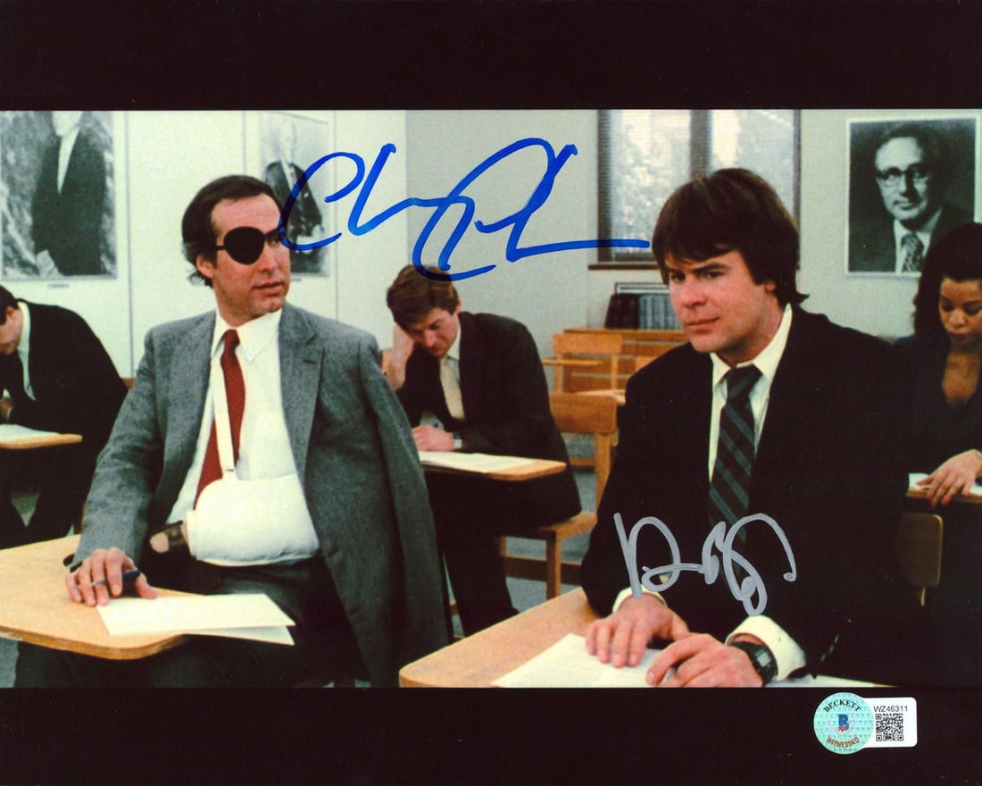 8x10 Photograph Signed by Chevy Chase and Dan Aykroyd Beckett COA: 8x10 Photograph Signed by Chevy Chase and Dan Aykroyd Beckett COA This is an original 8x10 classroom photograph from "Spies Like Us" that has been personally signed by Chevy Chase and Dan Aykroyd. The