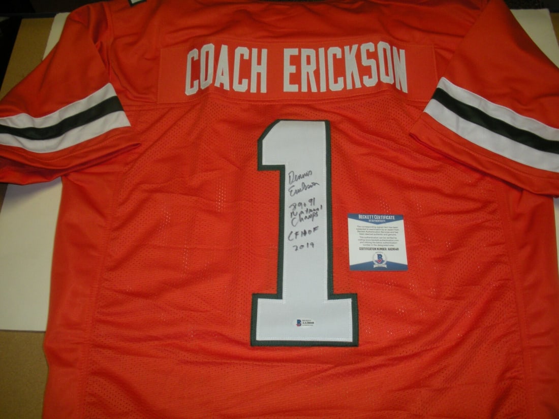 Dennis Erickson Autographed Miami Hurricanes Jersey Beckett COA HOF 2019 Champ: Dennis Erickson Autographed Miami Hurricanes Jersey Beckett COA HOF 2019 Champ This pre-owned Miami Hurricanes jersey is signed by Dennis Erickson, commemorating the team's 1989 and 1991 championship 