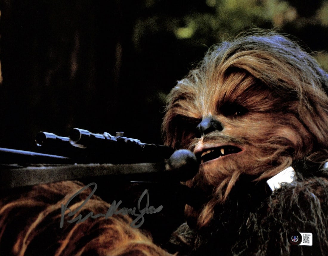 11x14 Beckett Authenticated Photo Signed by Peter Mayhew as Chewbacca from Star Wars: 11x14 Beckett Authenticated Photo Signed by Peter Mayhew as Chewbacca from Star Wars This is an original 11x14 photograph autographed in silver permanent marker by Peter Mayhew, who portrayed Chewbacc