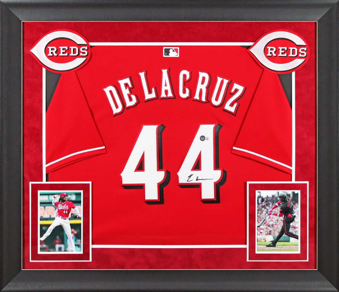 Framed Elly De La Cruz Red Nike Jersey Signed Beckett BAS Witnessed: Framed Elly De La Cruz Red Nike Jersey Signed Beckett BAS Witnessed This authentic red Nike framed jersey has been personally signed by Elly De La Cruz of the Cincinnati Reds. The signature was witnes