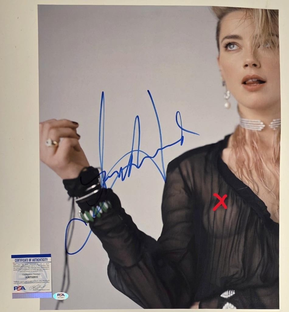 Signed Amber Heard 16x20 Photograph PSA COA: Signed Amber Heard 16x20 Photograph PSA COA This is an original 16x20 photograph signed by Amber Heard. The autograph has been authenticated by Professional Sports Authenticator (PSA/DNA), ensuring it