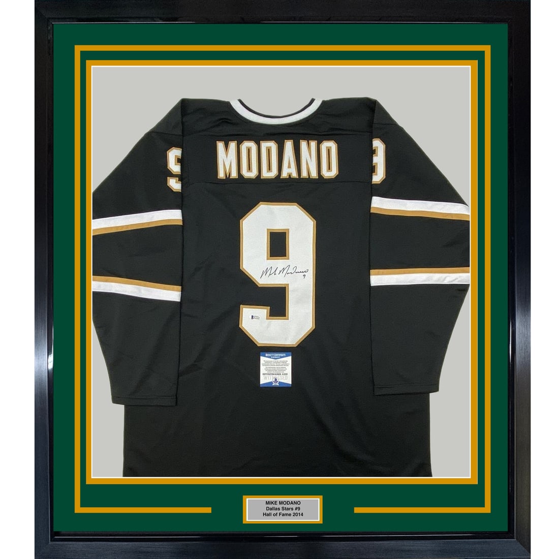 Framed Mike Modano signed Dallas Stars black jersey BAS COA 33x42: Framed Mike Modano signed Dallas Stars black jersey BAS COA 33x42 This professionally framed and matted display features a Dallas Stars black jersey autographed by Mike Modano. The presentation includ