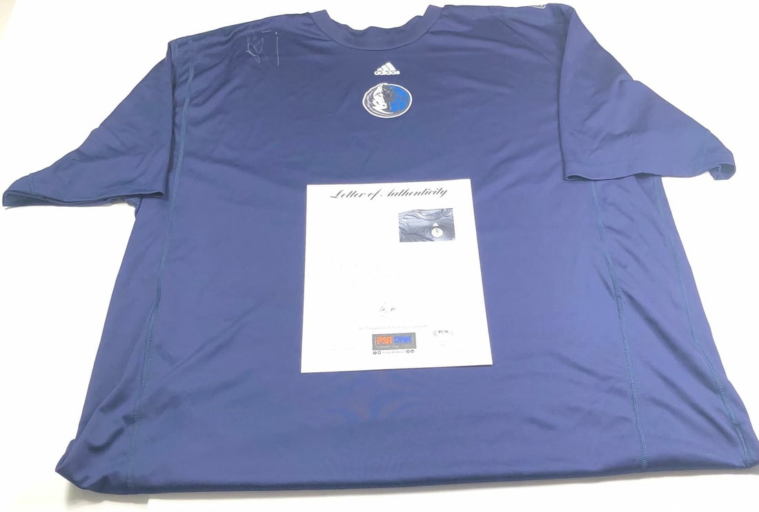 Dirk Nowitzki autographed Dallas Mavericks jersey PSA DNA LOA: Dirk Nowitzki autographed Dallas Mavericks jersey PSA DNA LOA This is a stitched shirt autographed by Dirk Nowitzki of the Dallas Mavericks. The autograph has been authenticated by PSA/DNA. The shirt 