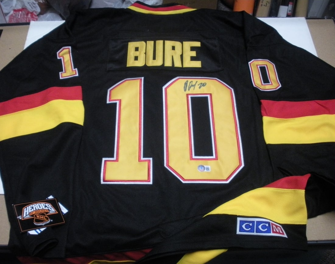 Signed Fanatics Canucks Pavel Bure NHL Jersey Beckett COA: Signed Fanatics Canucks Pavel Bure NHL Jersey Beckett COA This is an officially licensed Vancouver Canucks jersey signed by Pavel Bure. The jersey comes with Beckett certification and a certificate of