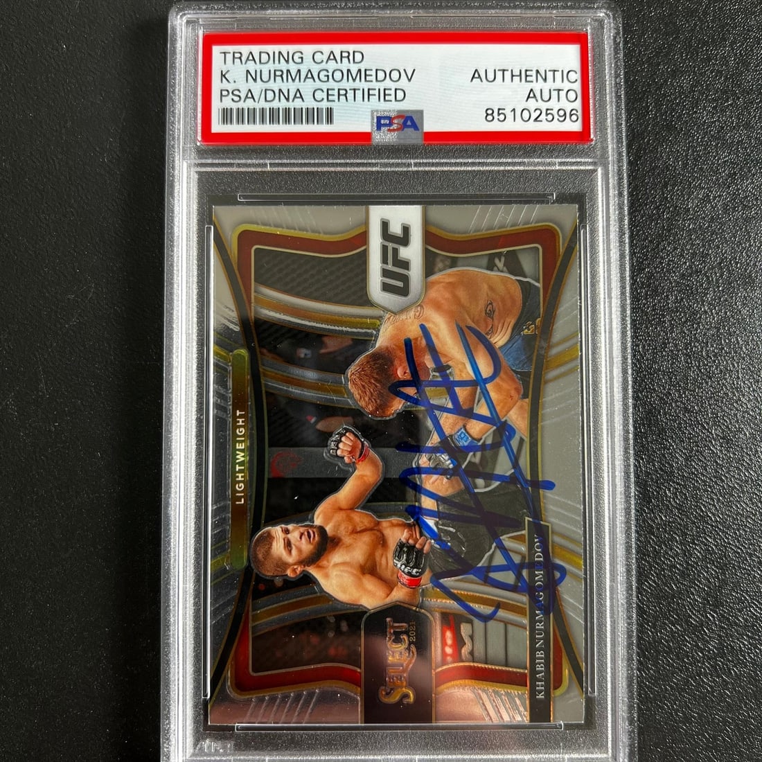 2021 Panini Select Khabib Nurmagomedov Signed Card PSA Authenticated: 2021 Panini Select Khabib Nurmagomedov Signed Card PSA Authenticated This is a 2021 Panini Select #161 signed sports trading card featuring Khabib Nurmagomedov, a renowned UFC athlete. The card, part 