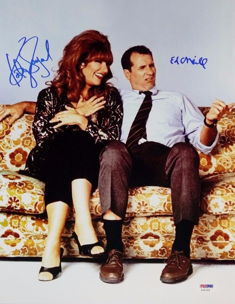 Ed O'Neill Katey Sagal Signed Married With Children 11x14 Photo PSA/DNA: Ed O'Neill Katey Sagal Signed Married With Children 11x14 Photo PSA/DNA This original 11x14 photo from the iconic show "Married With Children" features the signatures of both Ed O'Neill and Katey Saga