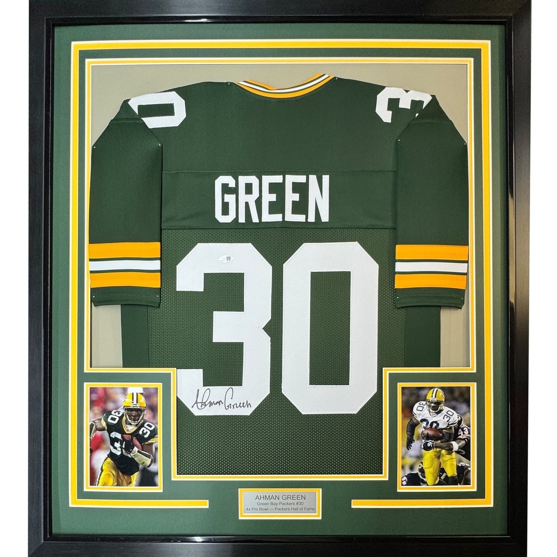 Ahman Green signed Green Bay Packers framed jersey 35x39: Ahman Green signed Green Bay Packers framed jersey 35x39 Professionally framed and matted signed Ahman Green Green Bay Packers jersey display with two 5x7 photos. This original football memorabilia pi