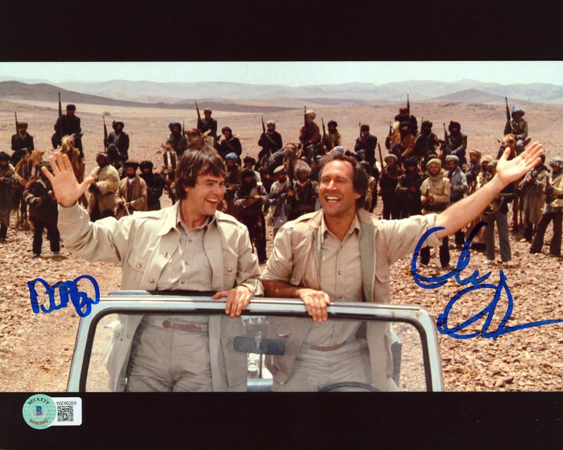 8x10 Photograph Signed by Chevy Chase and Dan Aykroyd with Beckett COA: 8x10 Photograph Signed by Chevy Chase and Dan Aykroyd with Beckett COA This is an original 8x10 photograph featuring a Jeep scene from the film "Spies Like Us," personally signed by Chevy Chase and Da