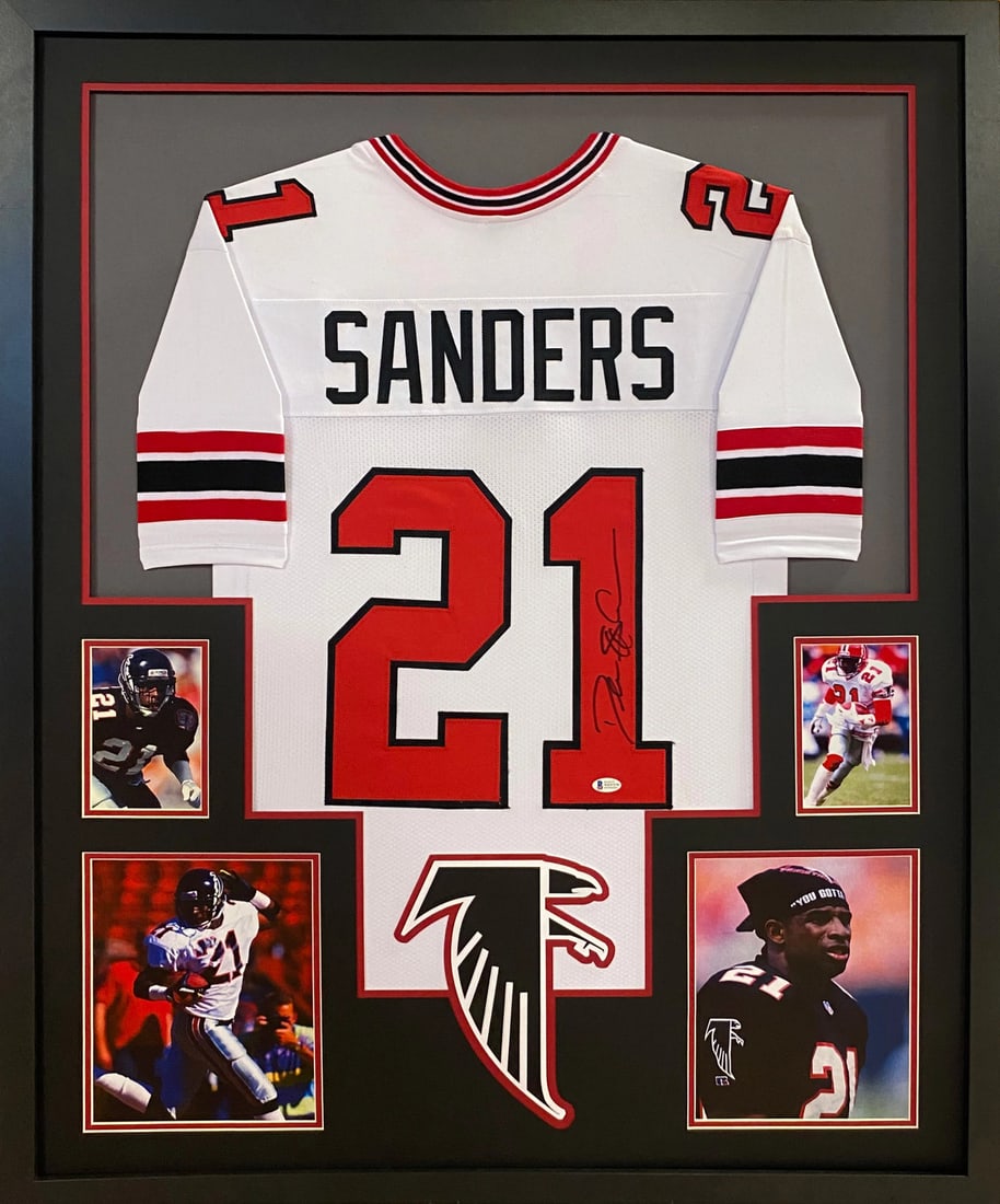 Framed Deion Sanders Autographed Falcons TB White Jersey Beckett: Framed Deion Sanders Autographed Falcons TB White Jersey Beckett Framed autographed Deion Sanders TB white Falcons jersey with detailed presentation and logo display. Authenticated by Beckett and incl